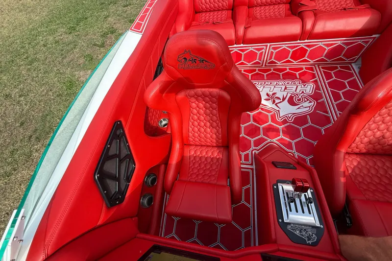 Slide: The Image of Red interior of 2020 HellKats 30 boat with hexagonal pattern and logo. - 38