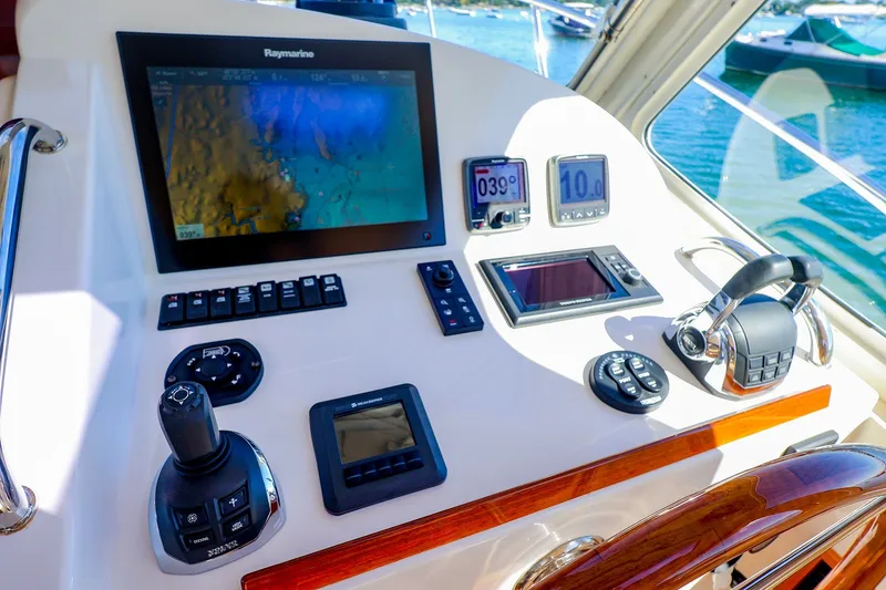 Slide: The Image of Control panel of 2017 MJM 40z Downeast boat with navigation and throttle controls. - 25