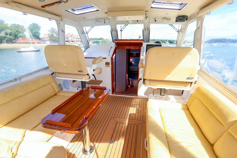 Slide: The Image of Luxurious interior of 2017 MJM 40z Downeast yacht with plush seating and wooden accents. - 16