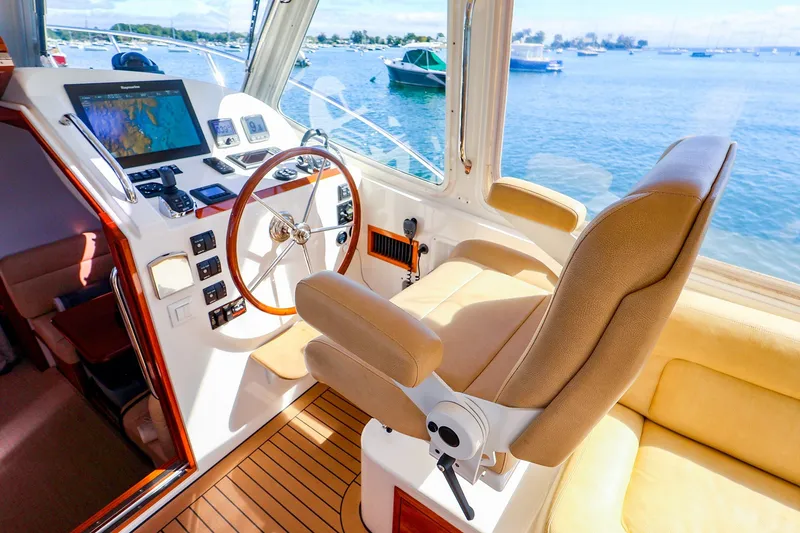 Slide: The Image of 2017 MJM 40z Downeast yacht helm with navigation equipment and luxurious seating. - 20