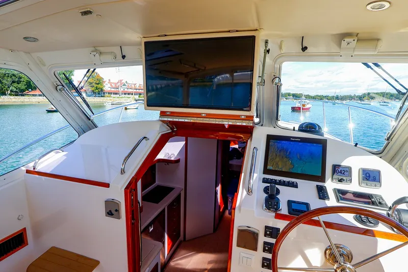 Slide: The Image of Interior view of a 2017 MJM 40z Downeast yacht cockpit with navigation equipment. - 24