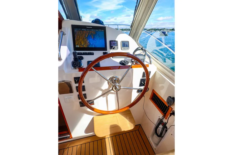 Slide: The Image of Helm of 2017 MJM 40z Downeast boat with navigation equipment and wooden steering wheel. - 22