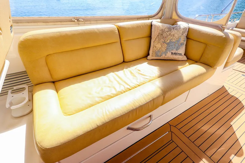 Slide: The Image of Luxurious yellow seating on 2017 MJM 40z Downeast yacht with nautical-themed pillow. - 17