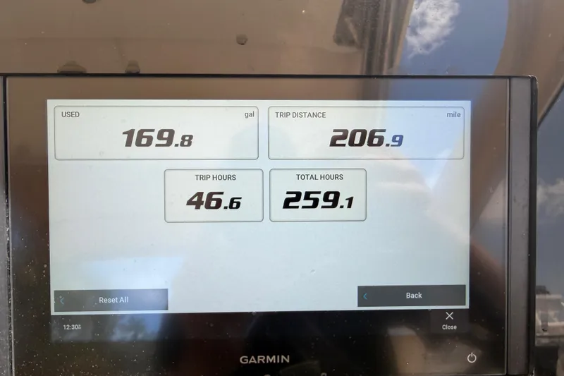 Slide: The Image of Garmin display showing fuel usage and trip data for 2020 Scout 235 Dorado boat. - 24