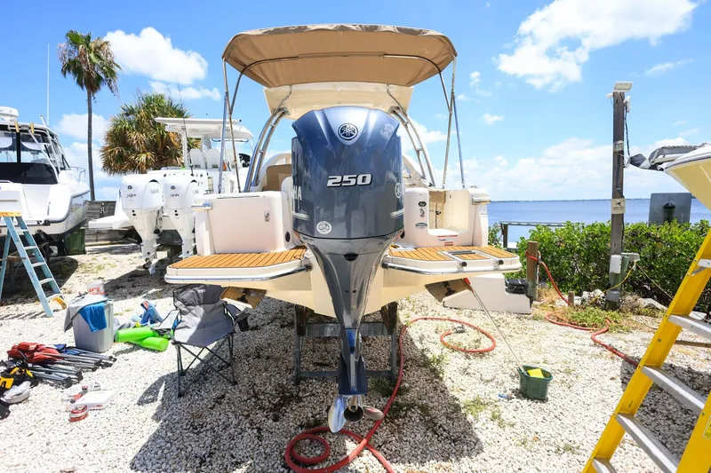 Slide: The Image of 2020 Scout 235 Dorado boat with Yamaha 250 engine, docked near water. - 3