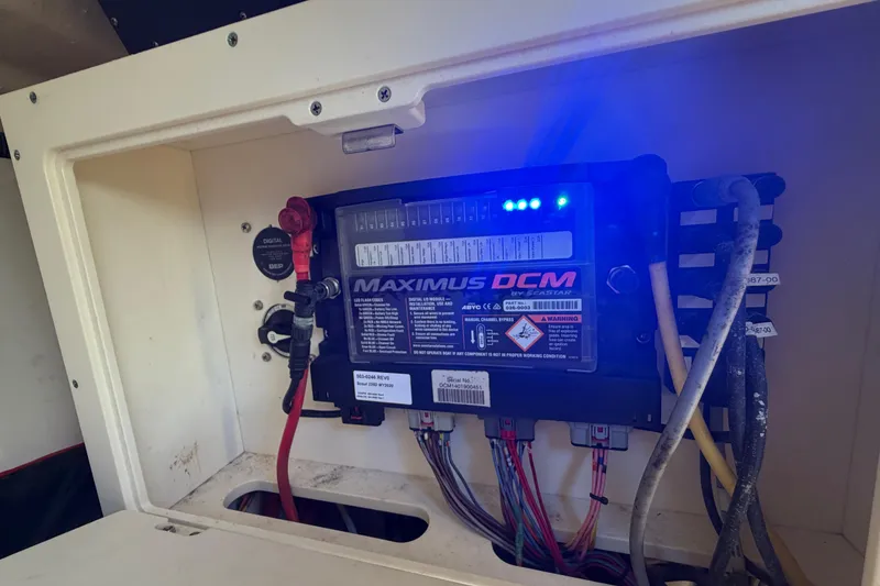Slide: The Image of Electrical panel in a 2020 Scout 235 Dorado boat, featuring Maximus DCM system. - 33