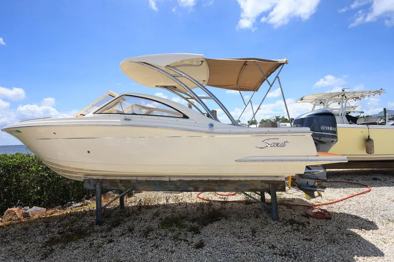 The Image of 2020 Scout 235 Dorado boat on display under a clear blue sky. - 0