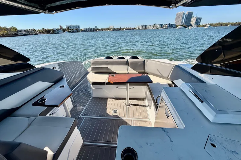 Slide: The Image of Luxurious 2022 New Cruiser Yachts GLS 38 interior with elegant seating and scenic water view. - 57