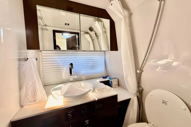 Slide: The Image of Luxurious bathroom in 2022 New Cruiser Yachts GLS 38, featuring modern sink and fixtures. - 45