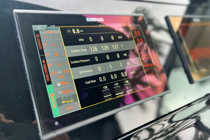 Slide: The Image of Simrad display on 2022 New Cruiser Yachts GLS 38 showing engine metrics and diagnostics. - 27