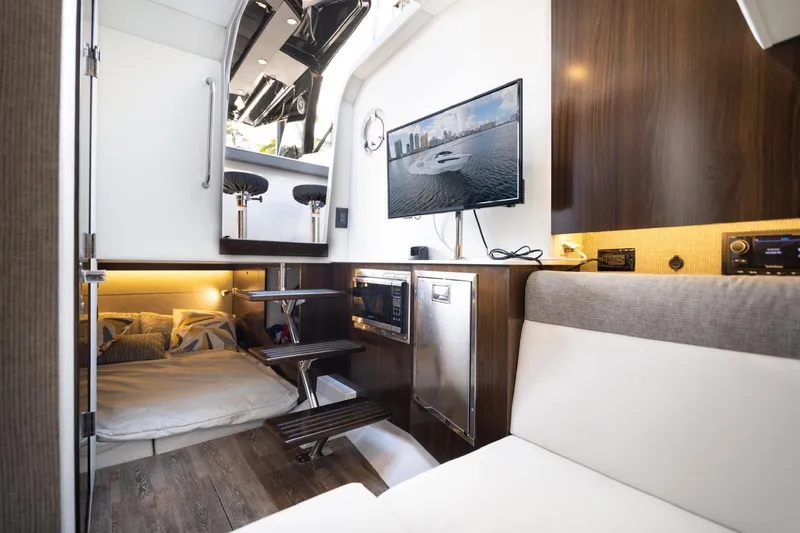Slide: The Image of Interior of 2022 New Cruiser Yachts GLS 38, featuring modern design and cozy sleeping area. - 39