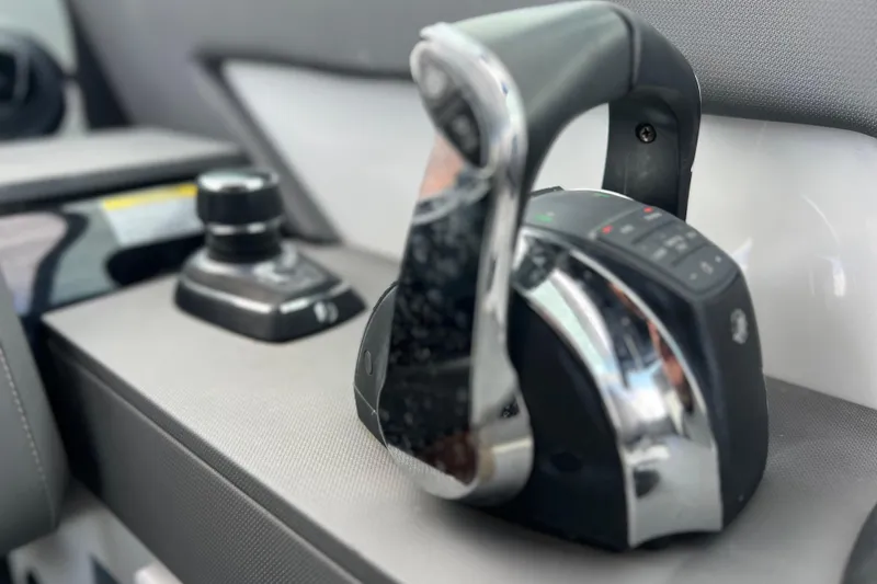 Slide: The Image of Close-up of 2022 New Cruiser Yachts GLS 38 throttle control and joystick. - 30