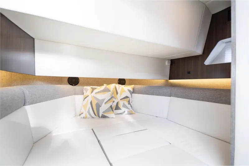 Slide: The Image of Luxurious interior of 2022 New Cruiser Yachts GLS 38 with modern cushions and ambient lighting. - 38