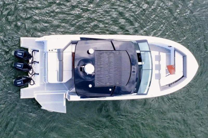 Slide: The Image of Aerial view of 2022 New Cruiser Yachts GLS 38 on water, showcasing sleek design and powerful engines. - 19