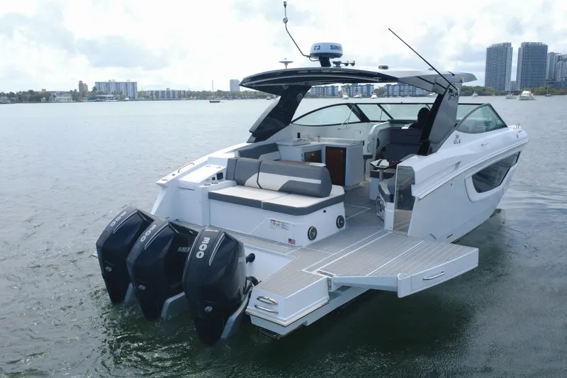 Slide: The Image of 2022 New Cruiser Yachts GLS 38 on water, featuring sleek design and powerful engines. - 15