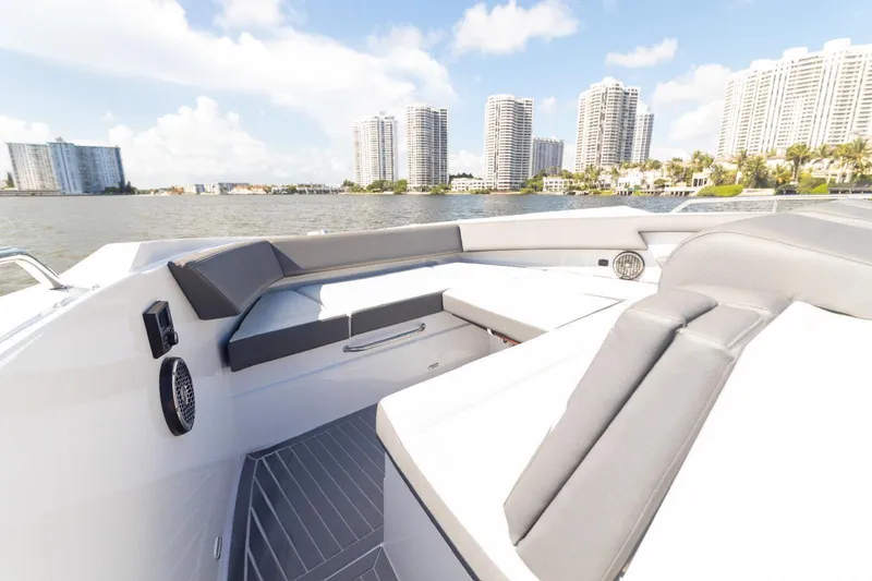 Slide: The Image of 2022 New Cruiser Yachts GLS 38 with luxurious seating, city skyline in background. - 53
