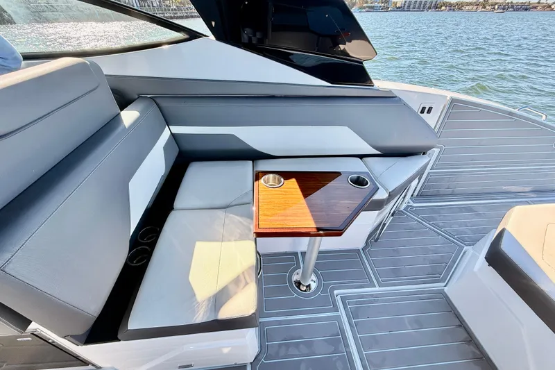 Slide: The Image of 2022 New Cruiser Yachts GLS 38 interior with sleek seating and wooden table on deck. - 61