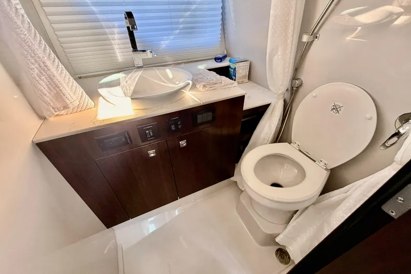 Slide: The Image of 2022 New Cruiser Yachts GLS 38 bathroom with modern sink and toilet. - 46