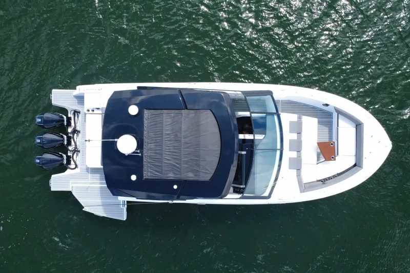 Slide: The Image of 2022 New Cruiser Yachts GLS 38, aerial view, sleek design, triple outboard engines. - 18