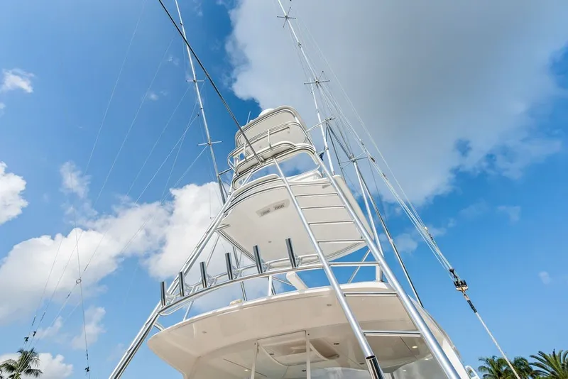 Slide: The Image of 2021 Viking 52 Sport Tower yacht tower against blue sky. - 34