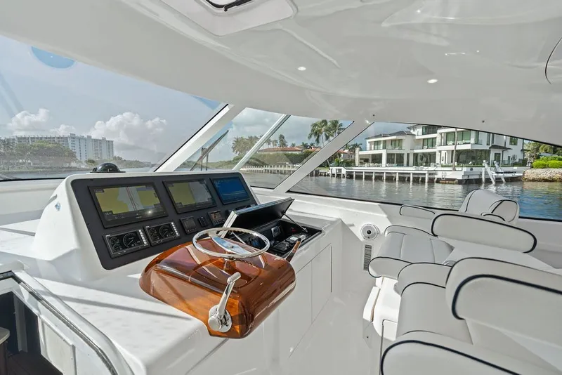 Slide: The Image of Interior view of 2021 Viking 52 Sport Tower yacht cockpit with modern navigation equipment. - 41