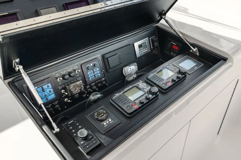 Slide: The Image of Control panel of 2021 Viking 52 Sport Tower with advanced navigation and communication systems. - 44