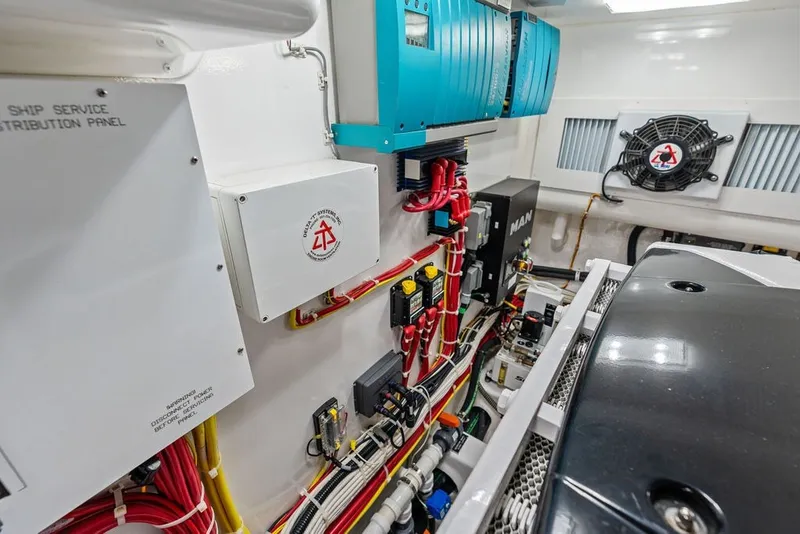 Slide: The Image of Engine room of 2021 Viking 52 Sport Tower with electrical panels and wiring. - 71