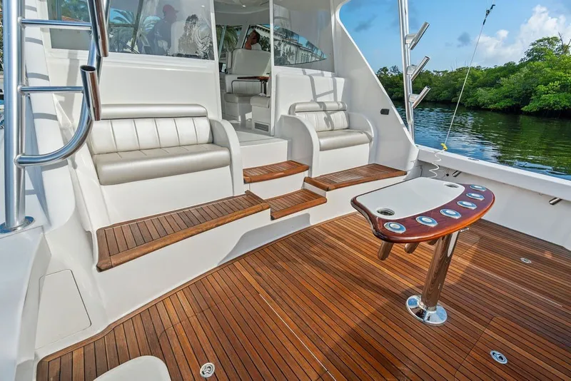 Slide: The Image of Luxurious 2021 Viking 52 Sport Tower yacht interior with teak flooring and plush seating. - 27