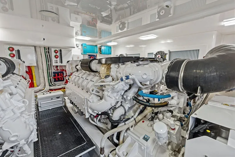 Slide: The Image of Engine room of a 2021 Viking 52 Sport Tower yacht, showcasing powerful machinery and wiring. - 66