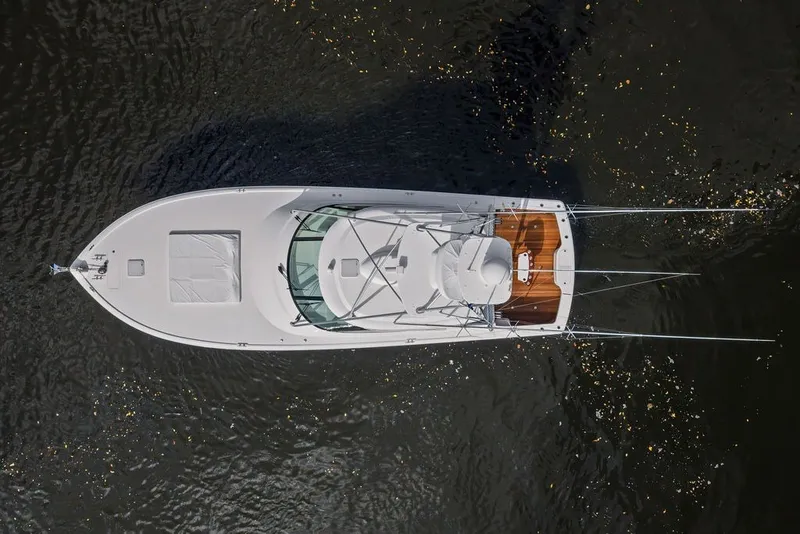 Slide: The Image of Overhead view of a 2021 Viking 52 Sport Tower yacht on water. - 23