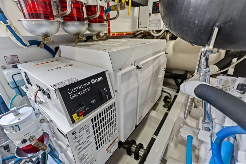 Slide: The Image of Engine room of 2021 Viking 52 Sport Tower with Cummins Onan generator. - 67
