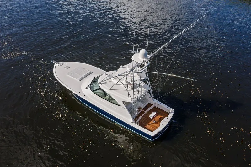 Slide: The Image of Aerial view of 2021 Viking 52 Sport Tower yacht on open water. - 4