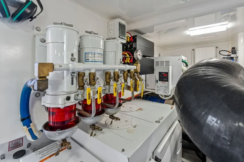 Slide: The Image of Engine room of 2021 Viking 52 Sport Tower with fuel filtration system. - 73