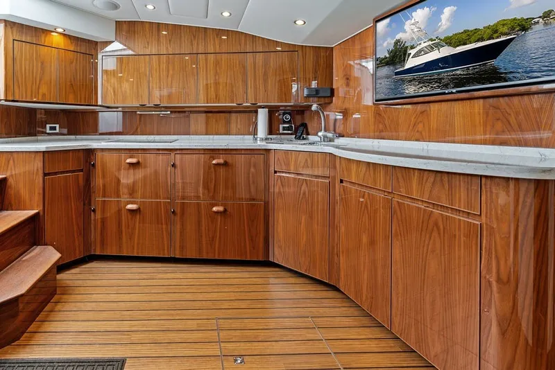 Slide: The Image of Luxurious wooden interior of 2021 Viking 52 Sport Tower yacht kitchen. - 49