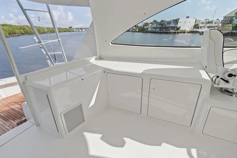 Slide: The Image of 2021 Viking 52 Sport Tower interior with sleek white cabinetry and waterfront view. - 37