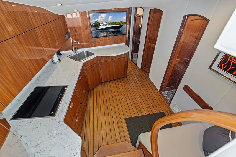Slide: The Image of Luxurious interior of 2021 Viking 52 Sport Tower yacht with modern kitchen design. - 48