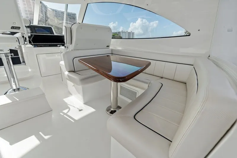 Slide: The Image of Luxurious interior of 2021 Viking 52 Sport Tower yacht with plush seating and sleek table. - 39