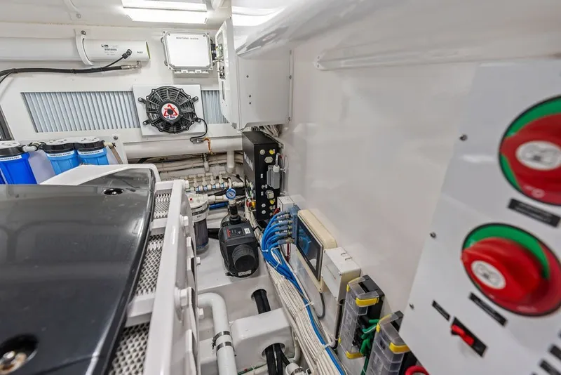 Slide: The Image of Engine room of 2021 Viking 52 Sport Tower with mechanical and electrical components. - 70
