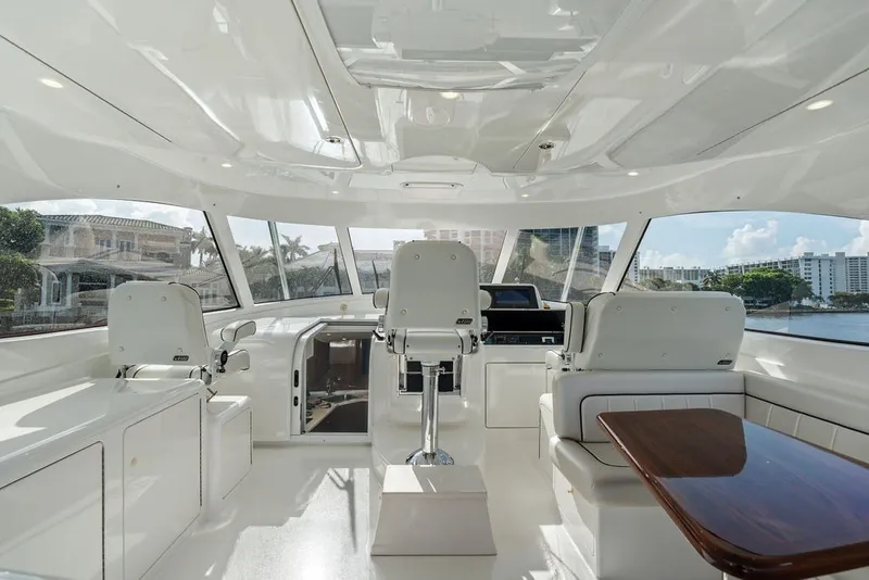 Slide: The Image of Luxurious interior of 2021 Viking 52 Sport Tower yacht with modern helm and seating. - 36