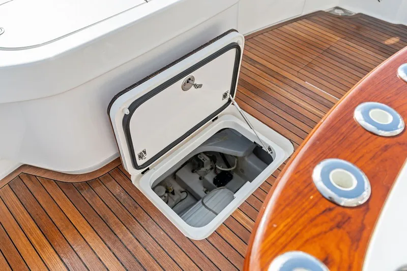 Slide: The Image of Open hatch on 2021 Viking 52 Sport Tower yacht, revealing engine compartment. - 32