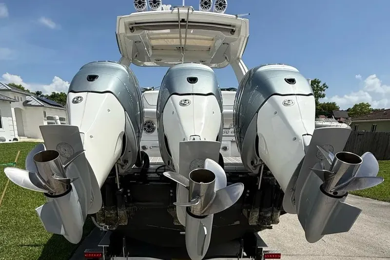 Slide: The Image of 2022 Formula 350 Crossover Bowrider with triple outboard engines, rear view. - 17