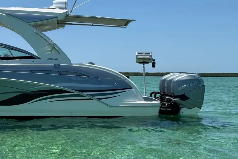 Slide: The Image of 2022 Formula 350 Crossover Bowrider with Mercury engines on clear water. - 5
