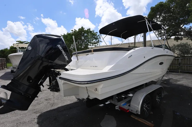 Slide: The Image of 2023 Sea Ray SPX 230 Outboard boat with Mercury engine on trailer. - 5