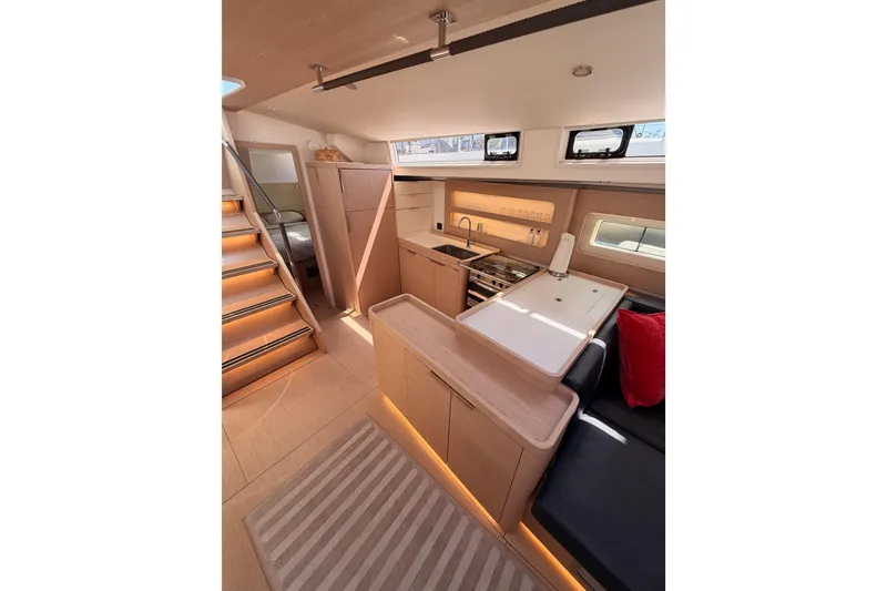 Slide: The Image of Luxurious interior of 2022 Beneteau Oceanis Yacht 54 with modern kitchen and cozy seating. - 46
