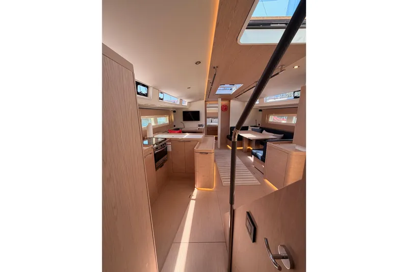 Slide: The Image of Luxurious interior of 2022 Beneteau Oceanis Yacht 54, featuring modern kitchen and seating area. - 59