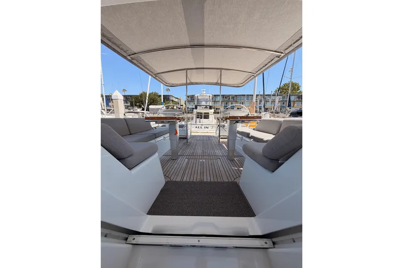 Slide: The Image of Spacious deck of 2022 Beneteau Oceanis Yacht 54 with comfortable seating and canopy. - 91