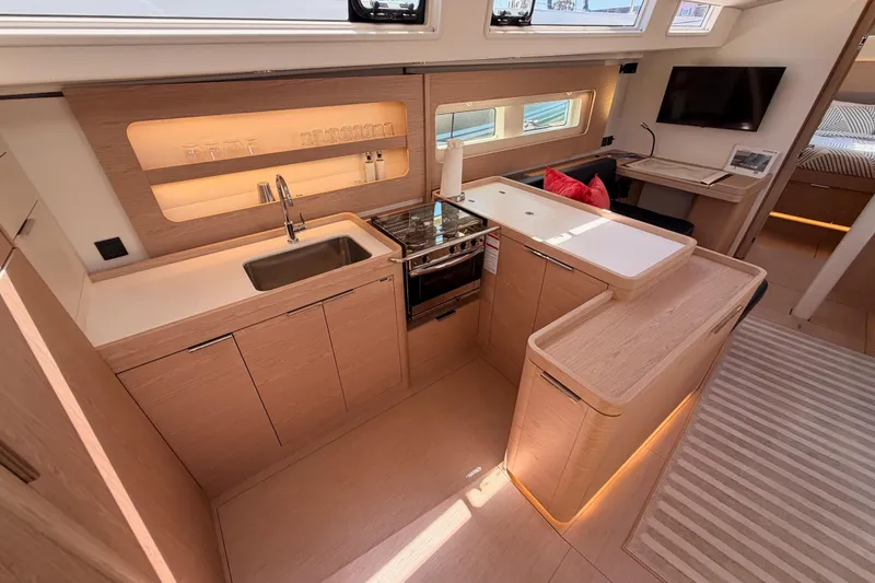 Slide: The Image of Luxurious interior of 2022 Beneteau Oceanis Yacht 54 with modern kitchen and elegant design. - 47