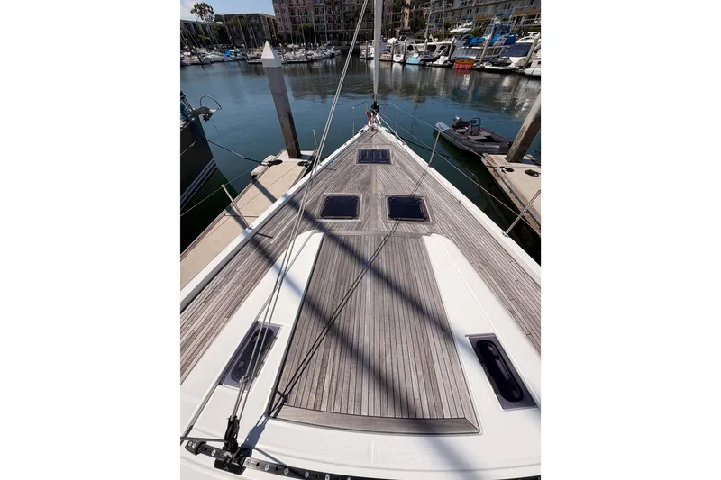 Slide: The Image of Deck view of 2022 Beneteau Oceanis Yacht 54 docked at marina. - 19