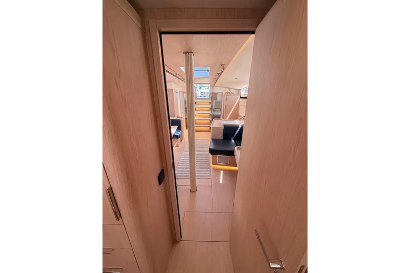 Slide: The Image of Interior view of 2022 Beneteau Oceanis Yacht 54, featuring modern design and wood finishes. - 86