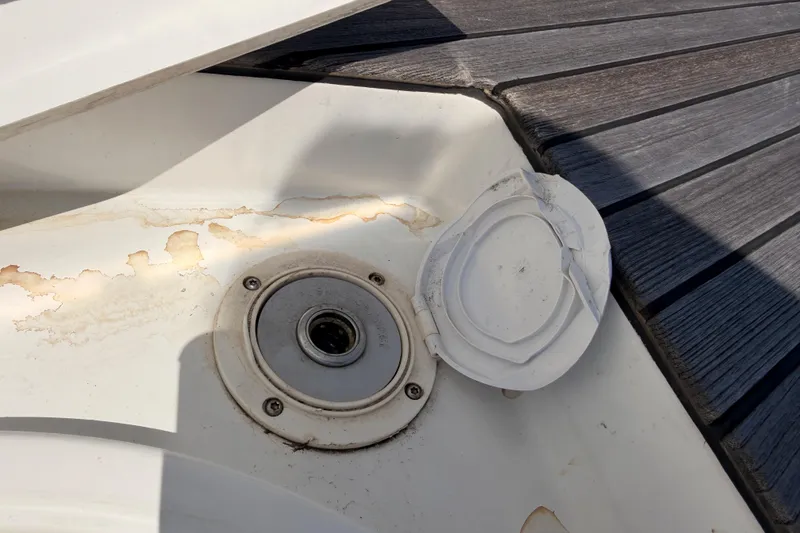 Slide: The Image of Deck detail of 2022 Beneteau Oceanis Yacht 54, showing a weathered hatch cover. - 24